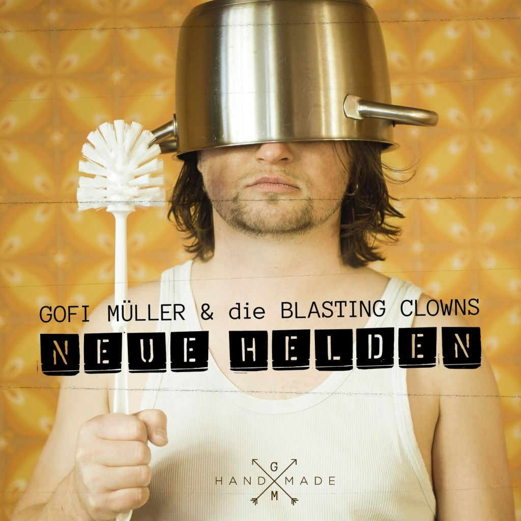 A man wearing a pot as a hat and holding a toilet brush, with a patterned orange background. Text on the image reads 'GOFI MÜLLER & die BLASTING CLOWNS NEUE HELDEN'.